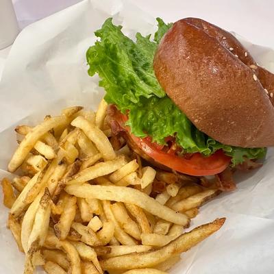 A burger and French fries meal.