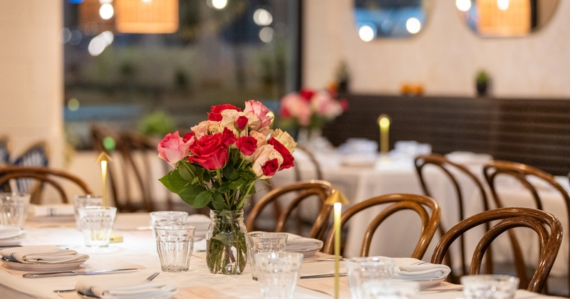 Exterior, side walk patio, cafe tables and chairs, close up