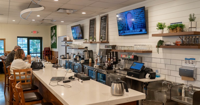 Interior, food counter, tv screens