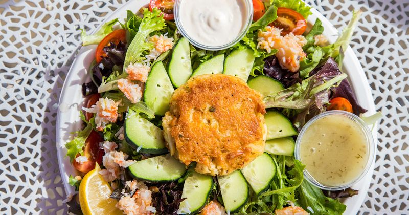 Salad with a large variety of greens and dips