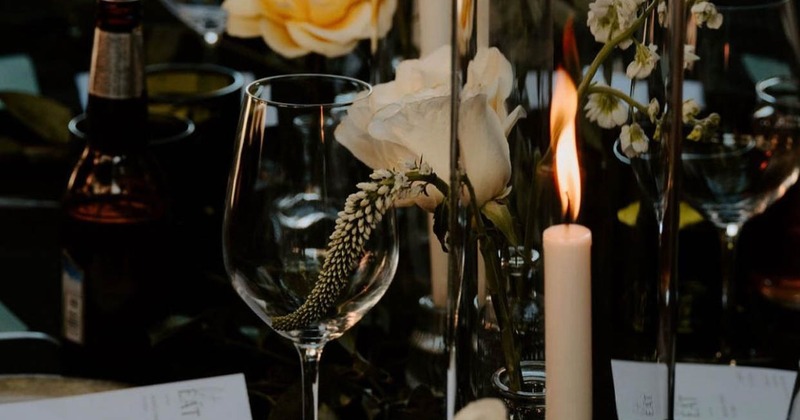 Interior, wedding setup, lavishly decorated tables for twelve and eight