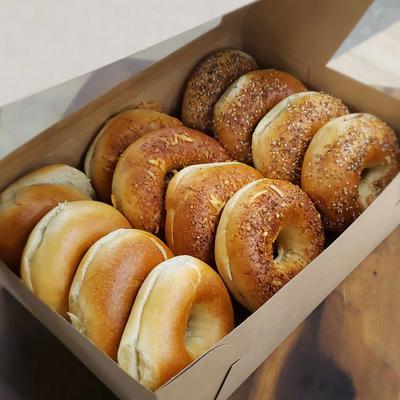 One dozen bagels in a box.