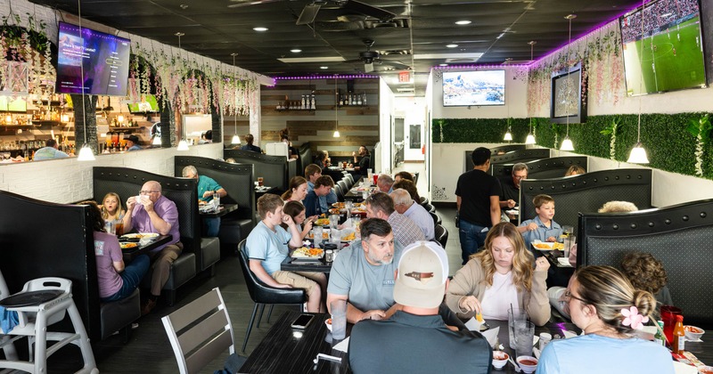Busy restaurant dining room with seated guests