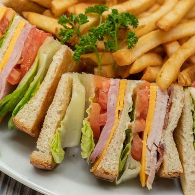 Club sandwich with fries on the side
