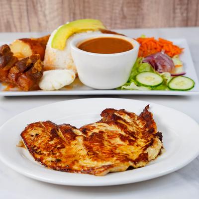 Grilled chicken with sides.