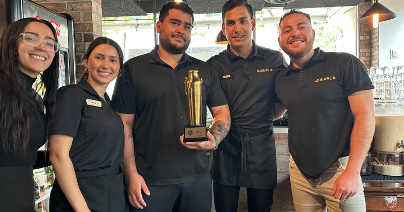 Staff posing with an award