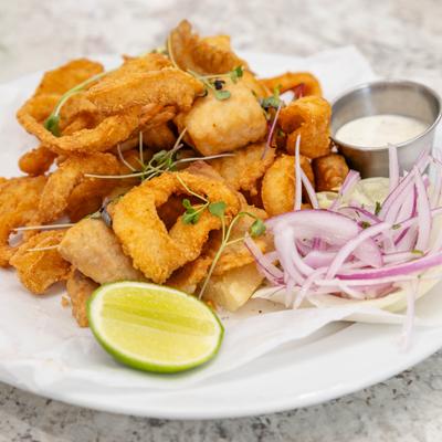 Peruvian fried seafood paired with lime, red onions, and dipping sauce.