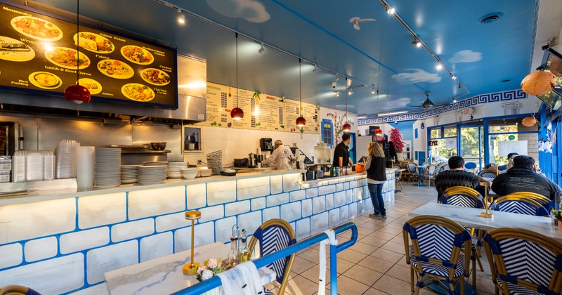 Interior, food counter, tables and chairs, guests