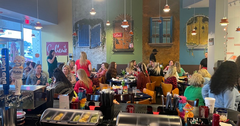 Interior, dining tables waiting to receive guests