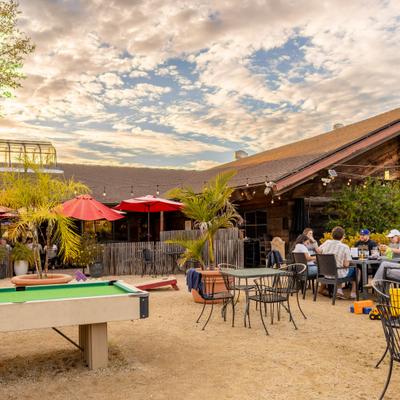 Outdoor seating area with a pool table.