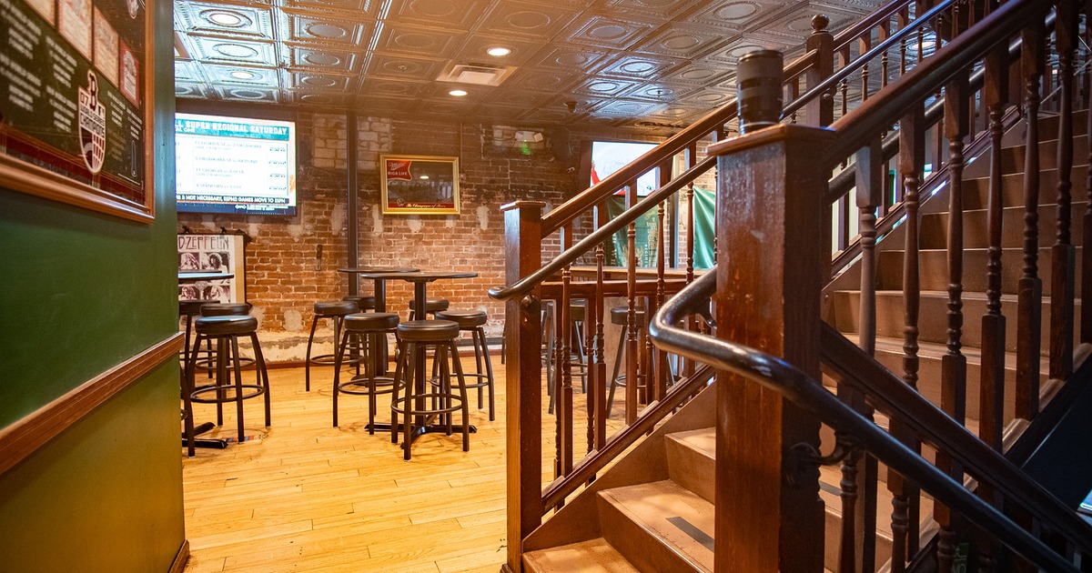Pub interior, seating area, stairs for the second floor