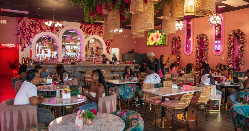 Lively and cozy restaurant interior space, dining area full of guests