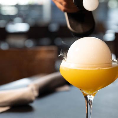 Yellow cocktail in the glass