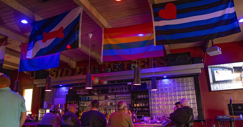 Interior, guests sitting at the bar
