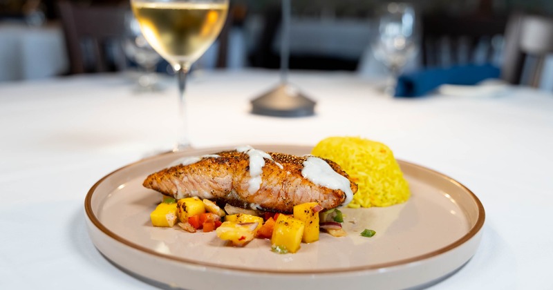 Blackened Scottish Salmonm served with fruit salsa and rice pilaf