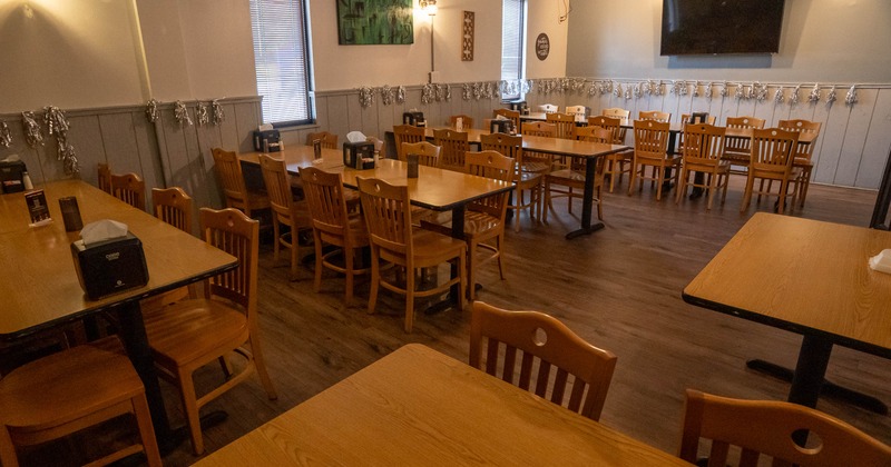 Dining area with wooden tables and chairs