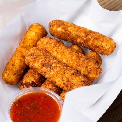 Mozzarella sticks served with marinara sauce.