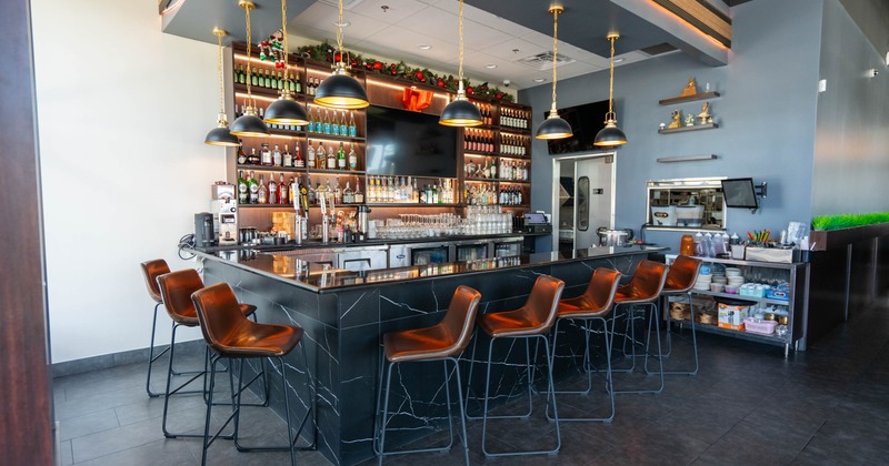 Bar area with marble counter and stools