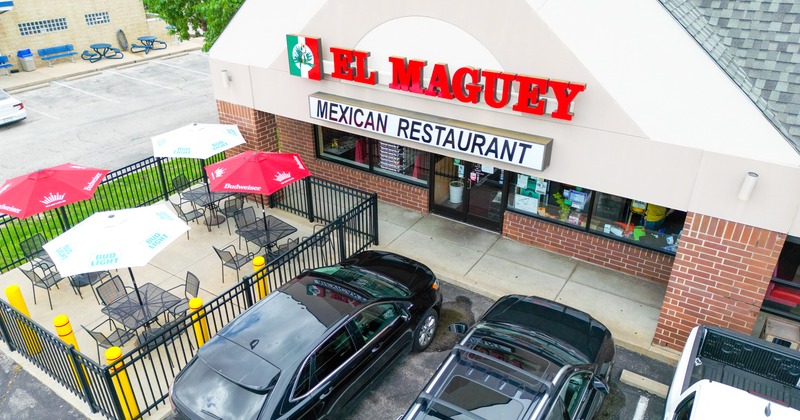 Exterior, aerial view to restaurant, parking lot, entrance, sign above
