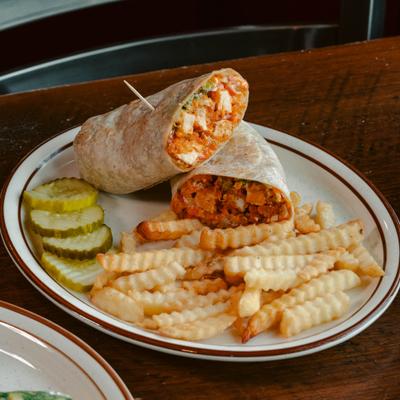 Hand breaded Buffalo Chicken Wrap rolled with lettuce, tomato, crumbled blue cheese, and Ranch..
