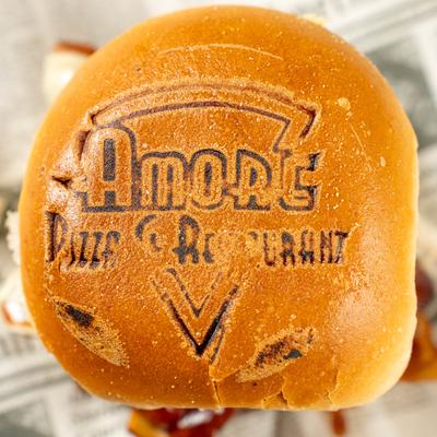 Burger with the restaurant logo burned into the bun.