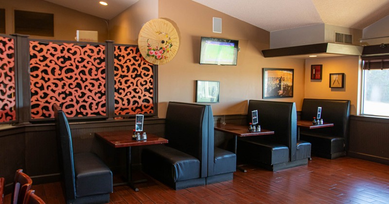 Interior, black leather, high back benches and tables