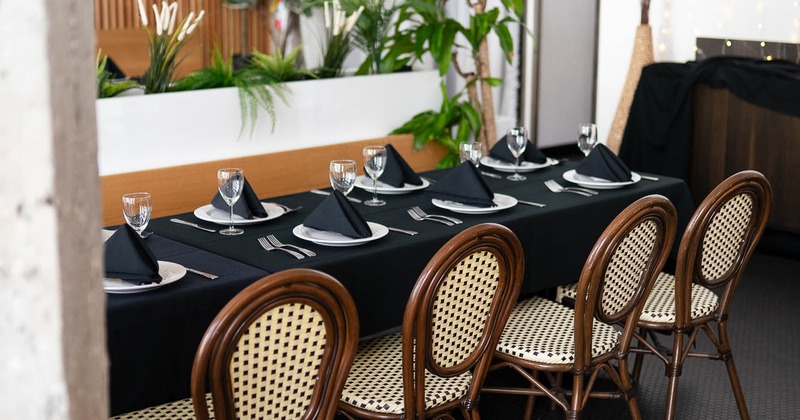 Interior, long table ready for guests