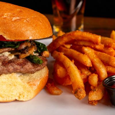Burger with fries, close-up.