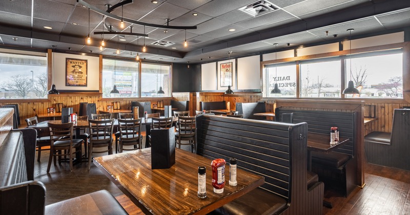 Interior, leather and wooden dining booths, tables and chairs