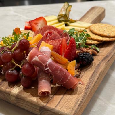 Antipasto Board, artisan cheese & cured meats, local fruits, olives & house made baguette.