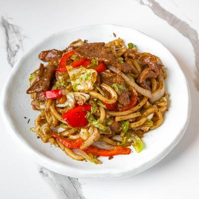 Plate of Beef Fried Udon with Black Pepper.