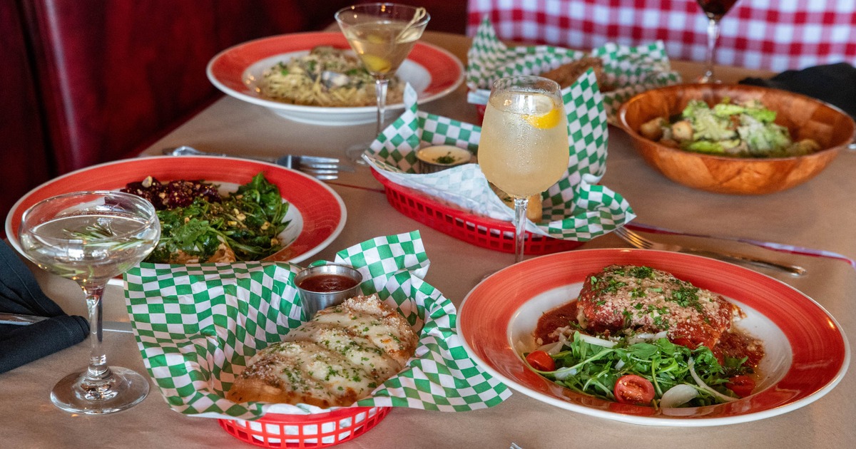 Variuos dishes served on the table with cocktails
