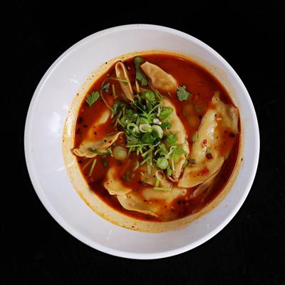 Steamed dumplings in hot and spicy sauce.
