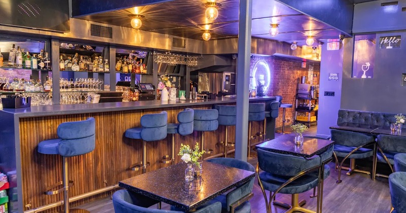 Modern style of interior design with a bar and seating area