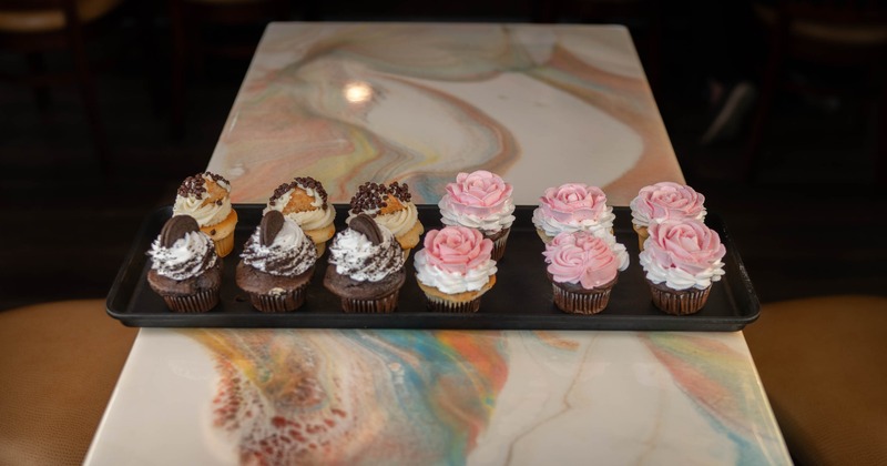 A tray of assorted cupcakes