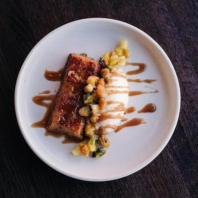 Pineapple Brown Butter Cake with Candied Pineapple, Golden Raisins, Mint, Cinnamon Caramel, Marscapone..