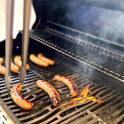 Sausages being cooked on the grill.