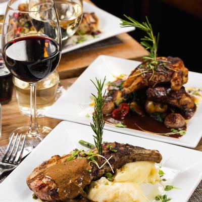 Two different types of food and glass of red wine