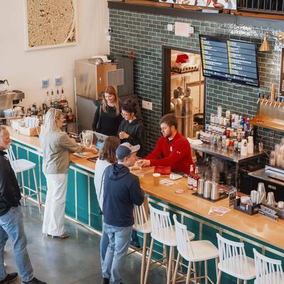 People waiting in line at the serving counter.