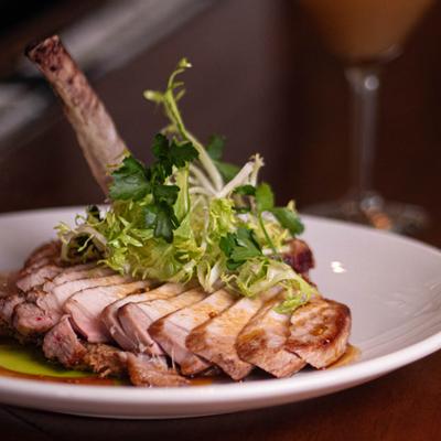 Pork chop topped with greens