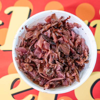 Sweet and sour red cabbage, cooked with bacon, and onions.