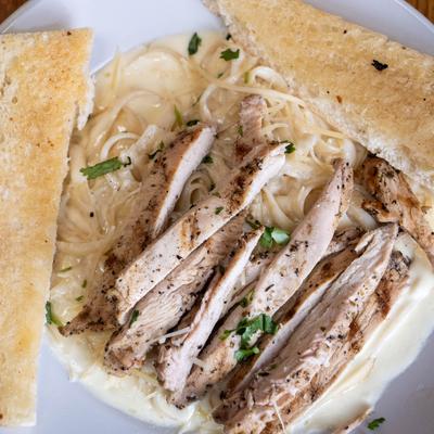 Chicken Fettucine Alfredo with garlic bread.