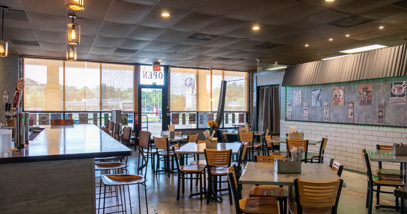 Interior, dining area, marble top tables for four, restaurant entrance, shop window