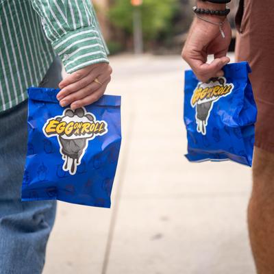 Hands holding packed goods.