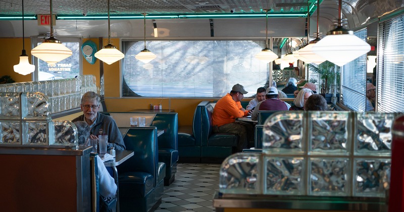 Interior, dining booths with guests