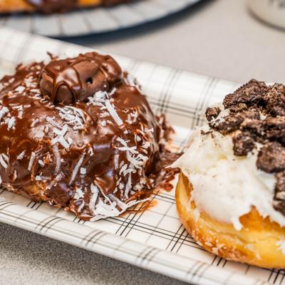 Chocolate Coconut Donut and Cookies and Cream Donut, close-up.