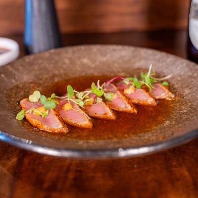 Tuna tataki topped with microgreens.