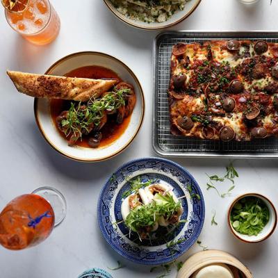 Various food plates drinks, overhead view.