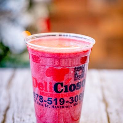 Red iced beverage served on the table.