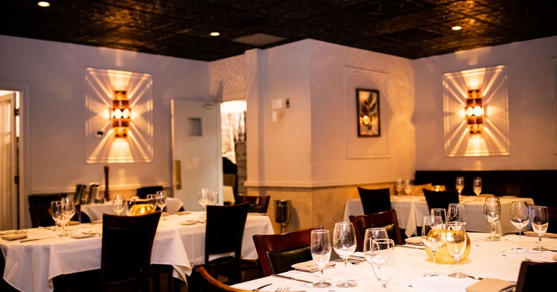 Interior, set dining tables ready to receive guests